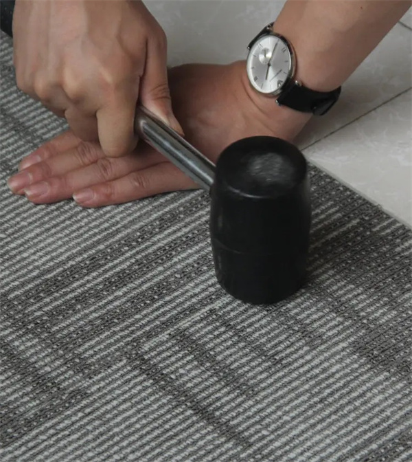 PVC carpet with fiberglass fleece
